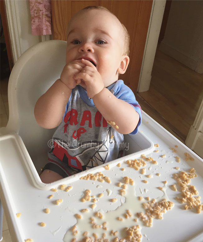 baby making a mess with breakfast